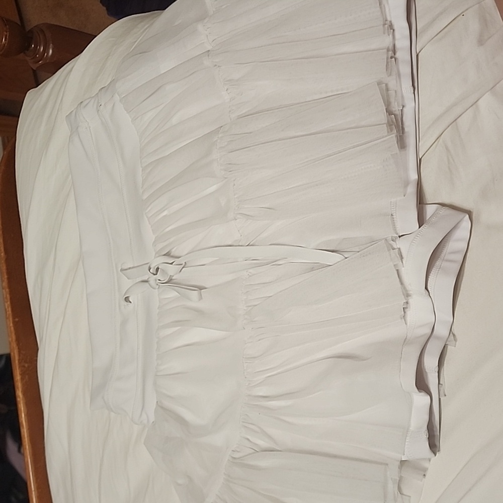 Pirouette Skort - Cool White, lightly stained.
